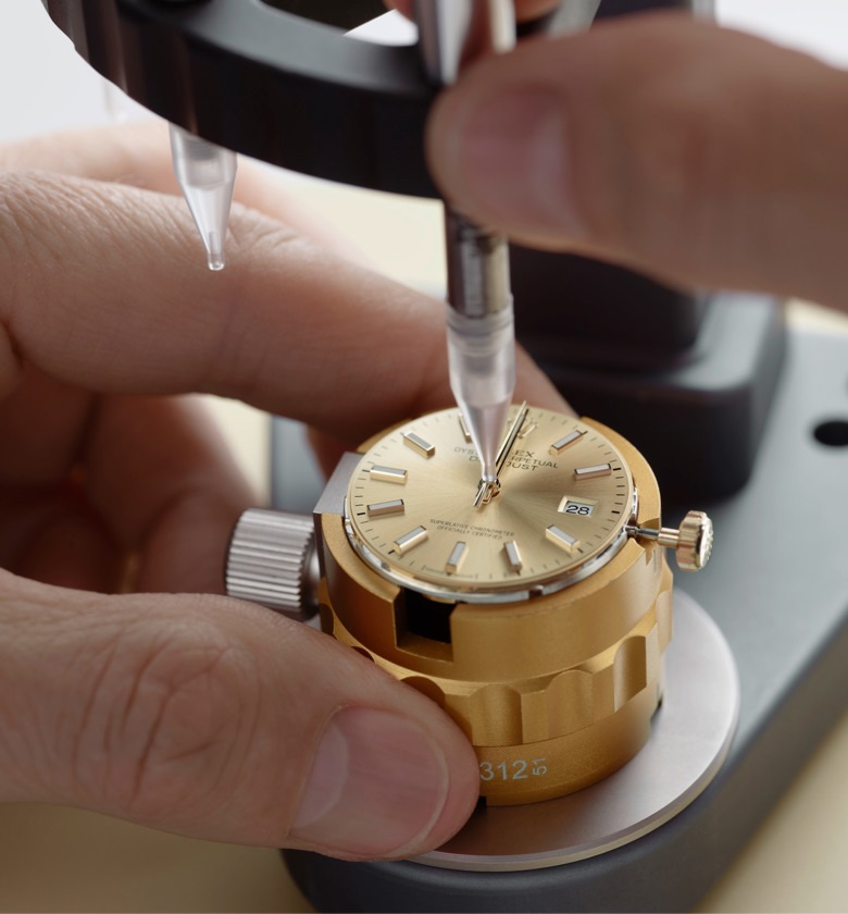 Rolex watchmaker assembling the watch