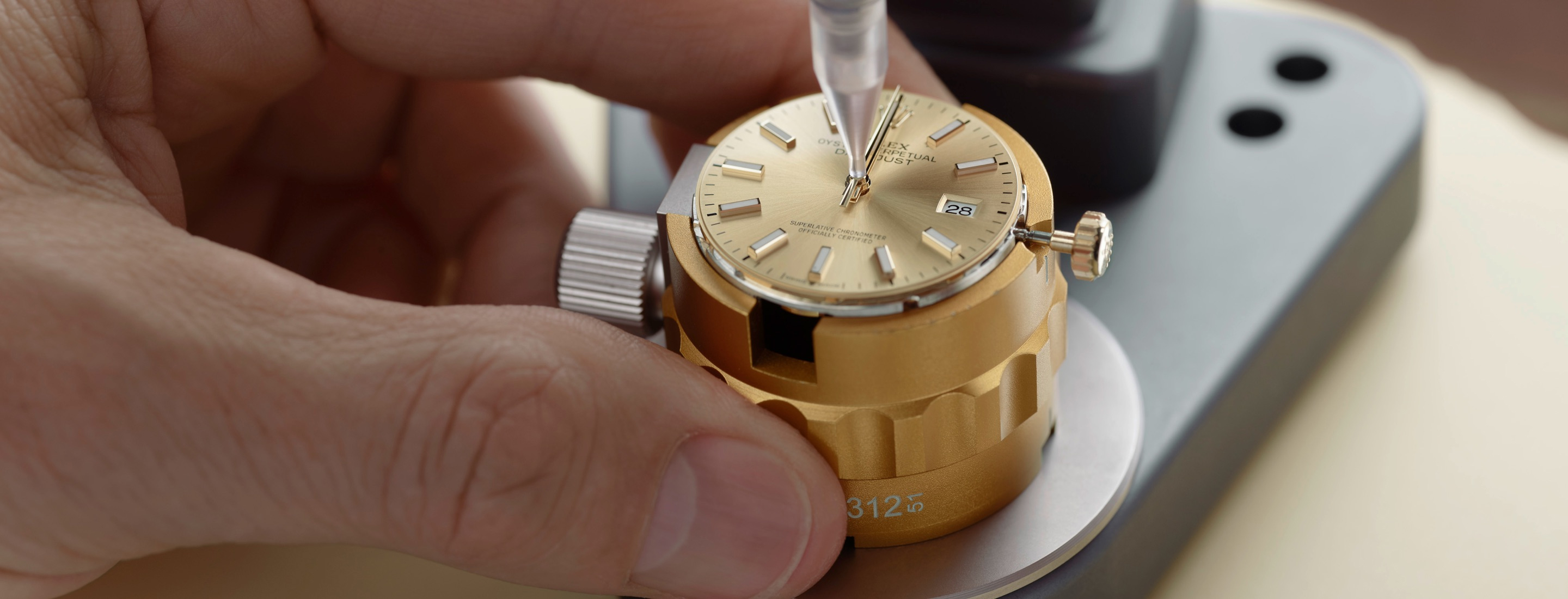 Rolex watchmaker assembling the watch