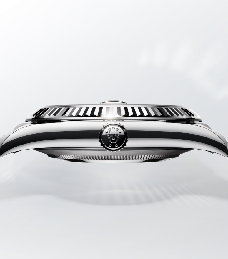 Rolex Datejust, highlighting fluted bezel and Rolex crown