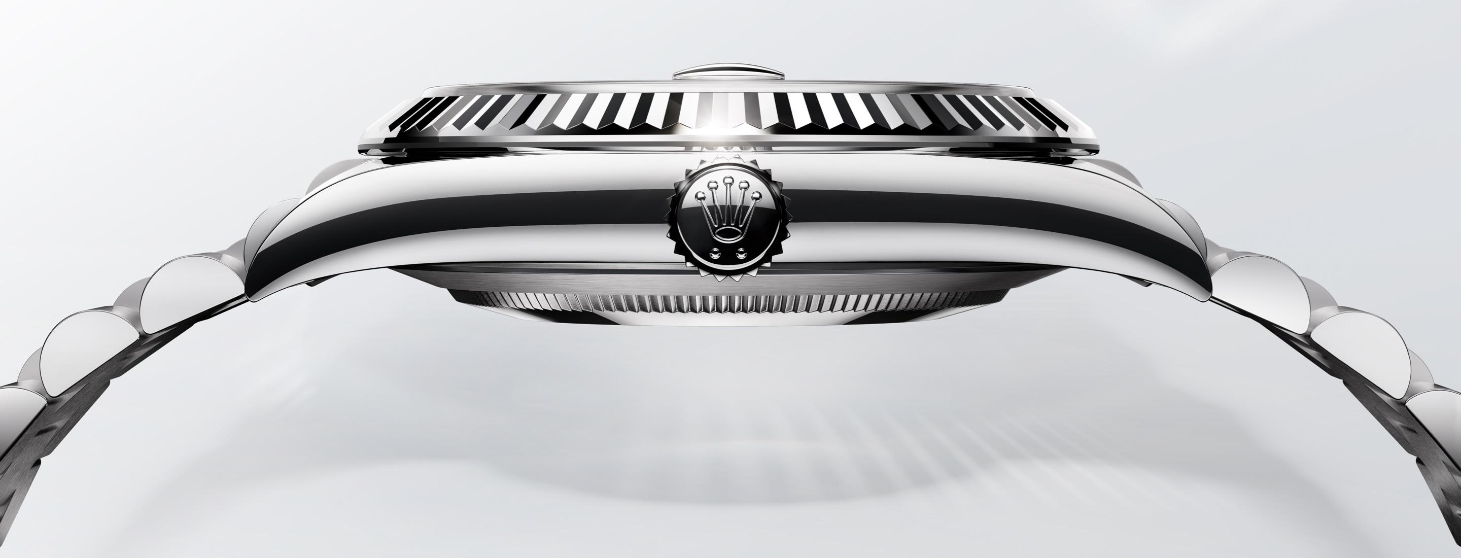 Rolex Datejust, highlighting fluted bezel and Rolex crown