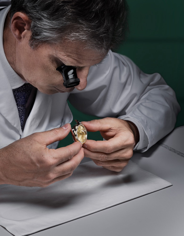 Rolex watch examined by a watchmaker