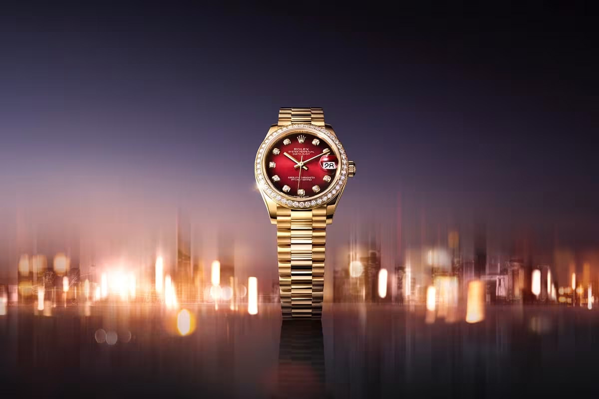Rolex Datejust in yellow gold, striking red ombré dial with diamonds